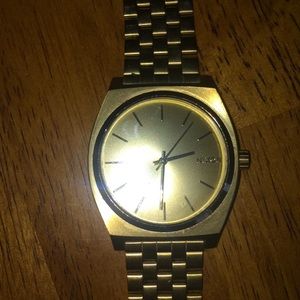 Men’s gold Nixon watch